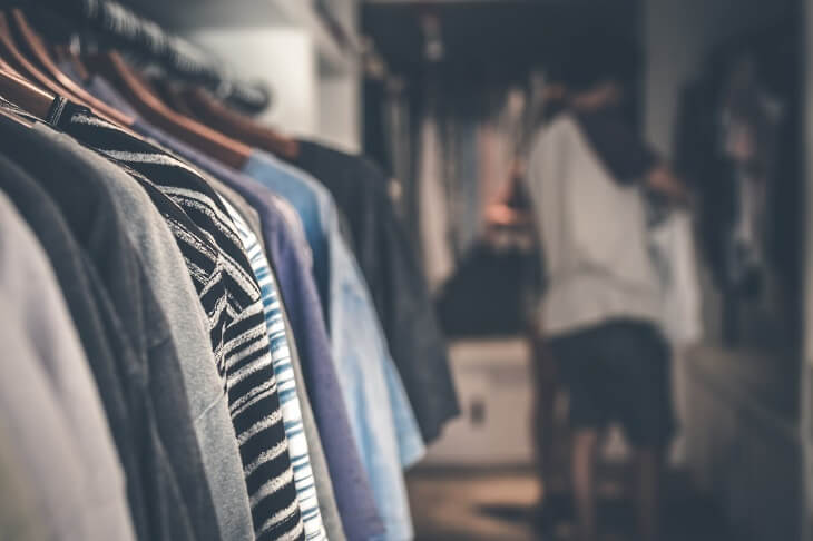 Clothes hanged in racks