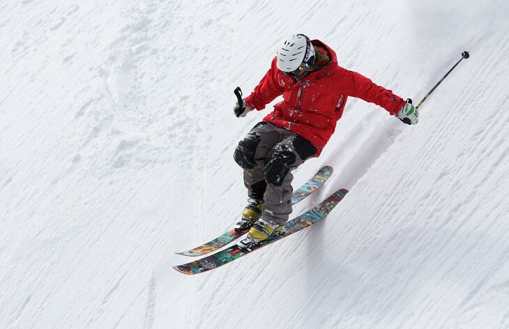 Man in red jacket skiing