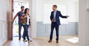 colorado buyers agent showing house to couple walking through red door